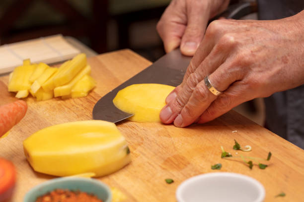 istock Chef demonstrating how to cut veggies for a food preparation class 1201985444