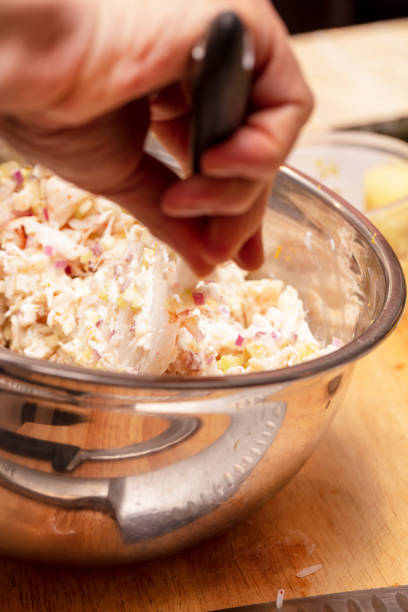 istock Crab meat and other ingredients in a bowl for a Sushi class 1201986436