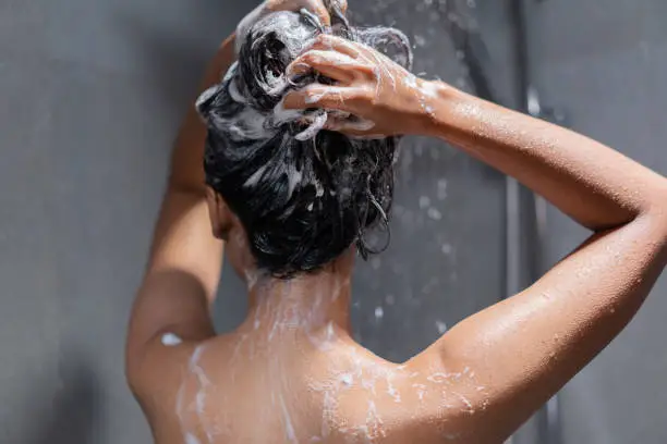 Photo of Woman bathing and washing her hair relaxed.
