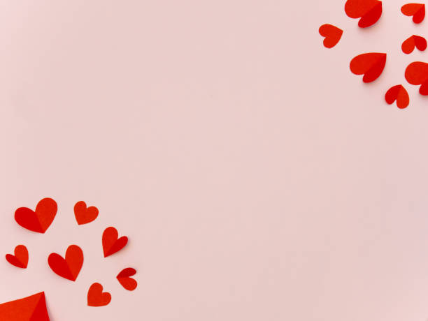 istock Red paper hearts on pink background with space for your text 1201994007