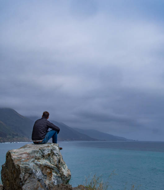 istock Man Overlooking the Ocean at Big Sur 1201995163