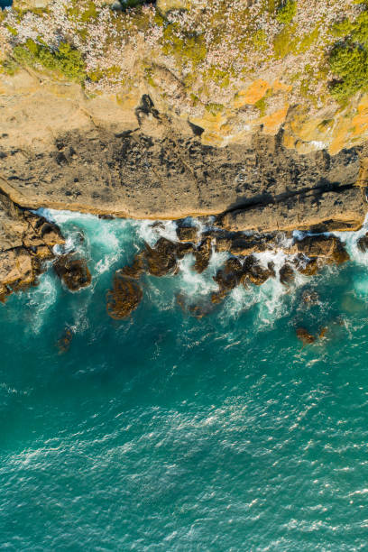 istock Top looking down at water splashing on rock. 1201997684