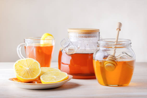 istock Fruit and herbal tea with lemon and honey. 1201997878