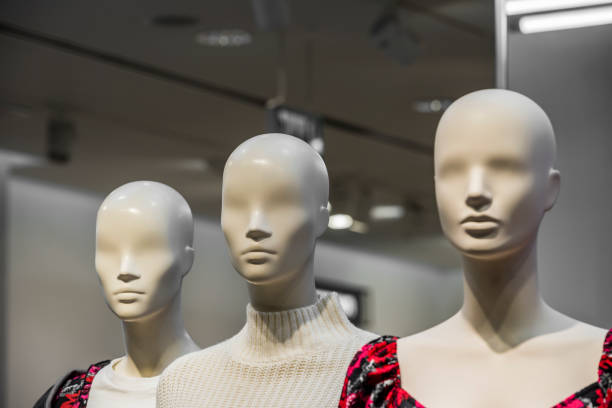 istock mannequin head Head of a white mannequin at store background 1202003467