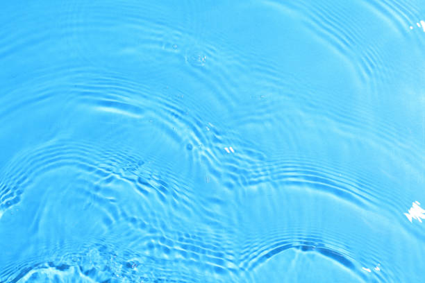istock texture of splashing clean water on blue background 1202004271