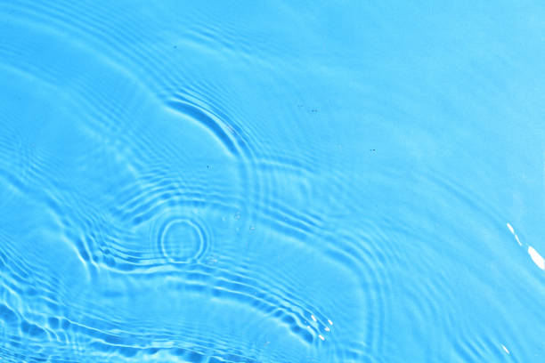 istock texture of splashing clean water on blue background 1202005259