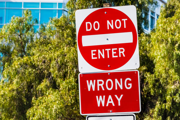 istock Do not Enter, Wrong Way traffic sign posted on a road 1202005278