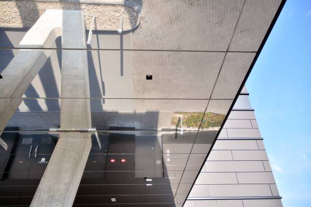 istock A view at a straight facade of a modern building with a dark grey facade. 1202005662