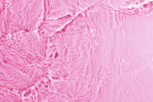 istock texture of splashing clean water on pink background 1202006715