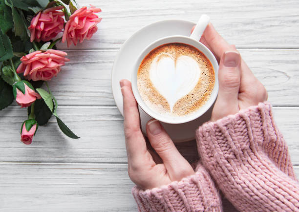 istock Woman holding cup of coffee 1202008294