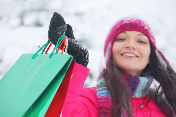 istock Shopping woman holding bags 1202013254