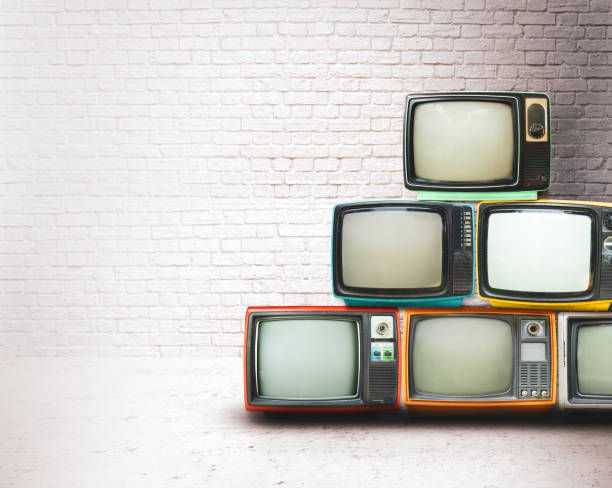 istock Retro televisions pile on floor 1202016051