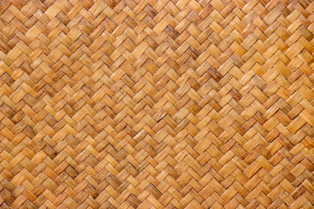 istock pattern of brown woven reed mat texture background, basketry crafted by Thai people. 1202019590