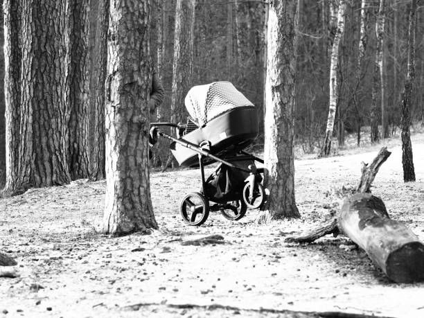 Moscow, Russia - January 26, 2020: a baby carriage is pushing by someone in the winter forest