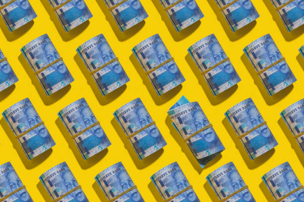 istock South african rand flat lay on yellow background 1202023804