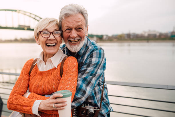 istock Senior couple on vacation enjoying by the river 1202025069