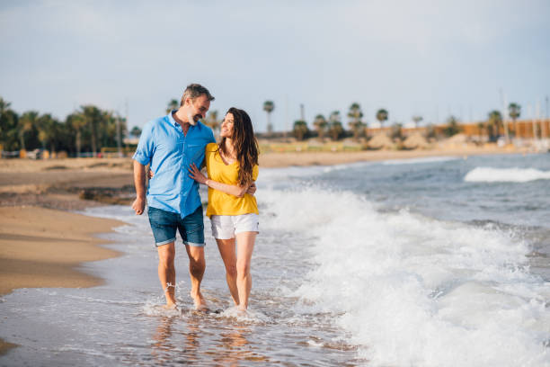 istock Couple relaxing during their beach holiday 1202029138
