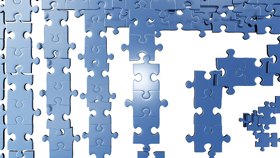 Top View of Several puzzle pieces placed soon with a white background