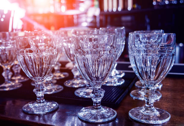 istock Wine and martini glasses in shelf above a bar rack in restaurant. 1202035486