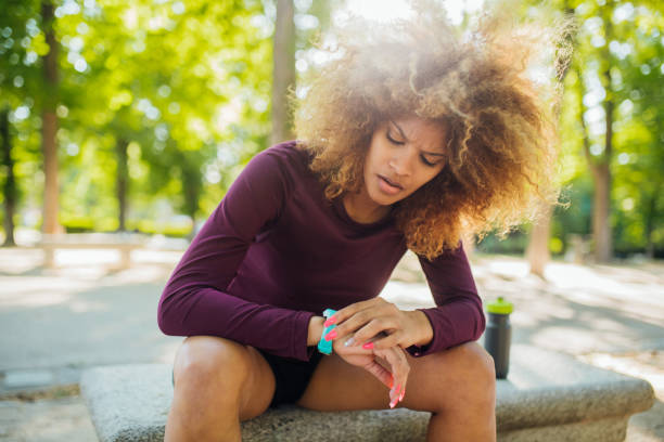 istock Girl checking the time after jogging in the park 1202035508