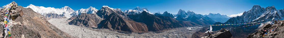 Dramatic panoramic view over the Ngozumba Glacier in the Solo Khumbu region of Nepal to the iconic rocky pyramid of Mt. Everest, from the snow capped summits of Cho Oyu, Gyachung Kang and Pumo Ri, the Everest massif, Nuptse and Lhotse and the magnificent peaks of Ama Dablam, Kang Tega and Thamserku in this sweeping Himalayan vista. ProPhoto RGB profile for maximum color fidelity and gamut.\n\n[b]See more great Himalayan images in this lightbox:[/b]\n\n[url=http://www.istockphoto.com/search/lightbox/7298188][img]http://www.fotovoyager.com/istock/lightbox_nepal.jpg[/img][/url]\n\n[b]See many more great landscape images in this lightbox:[/b]\n\n[url=http://www.istockphoto.com/search/lightbox/300969][img]http://www.fotovoyager.com/istock/lightbox_horizons.jpg[/img][/url]\n\n[b]See many more great panoramic images here:[/b]\n\n[url=http://www.istockphoto.com/search/lightbox/384048][img]http://www.fotovoyager.com/istock/lightbox_panoramas.jpg[/img][/url]