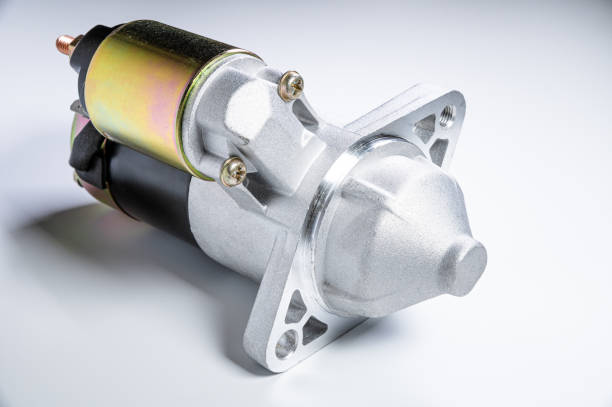 istock Starter of an internal combustion engine New Spare part for car on a gray background 1202041144
