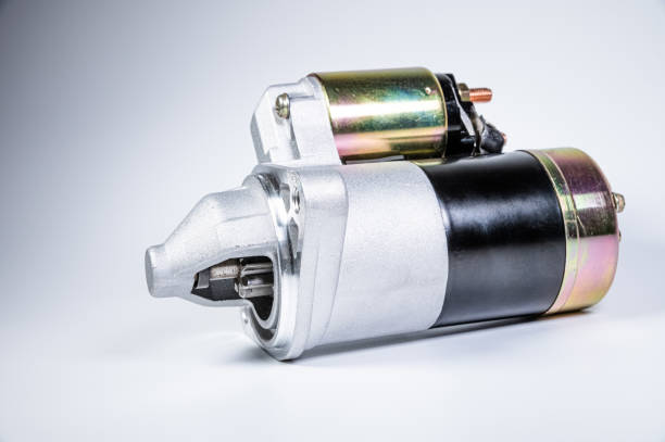 Starter of an internal combustion engine New Spare part for car on a gray background