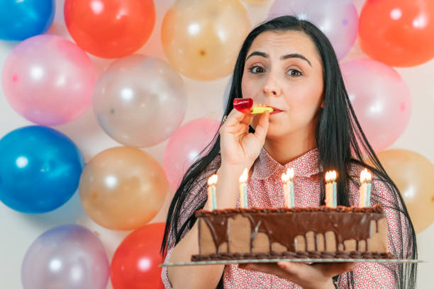 istock Young girl celebrating birthday 1202042033
