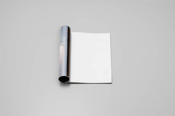 istock Mock-up magazine, newspaper or catalog on gray background. Blank page 1202042445
