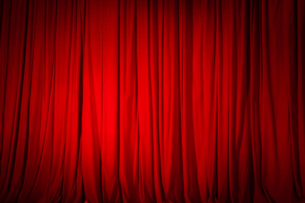 istock Closed red curtain in the theater, background texture 1202043598