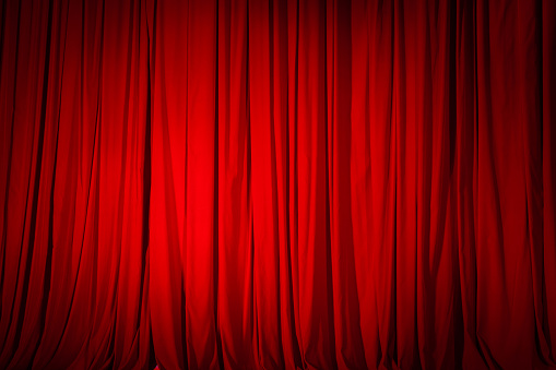 Closed red curtain in the theater, background texture