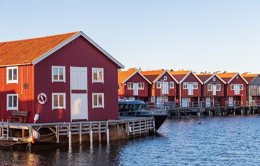 Traditional red boat houses along the Swedish west coast