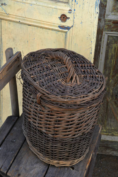 istock wicker basket on wooden chair 1202045377