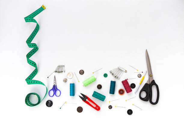 istock Sewing background. Set of tailoring tools on white background. 1202046631