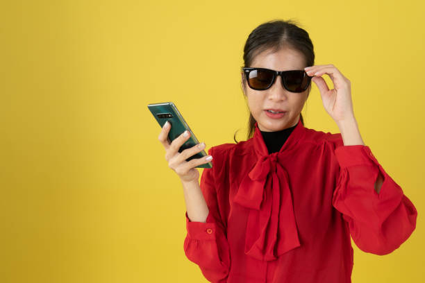 istock young lady waer sunglass in red shirt 1202048691