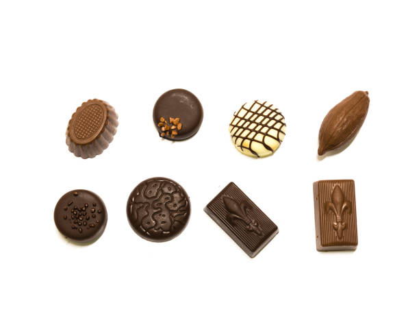 istock Studio shot chocolate pralines display in two rows decoration isolated on white top view 1202050239