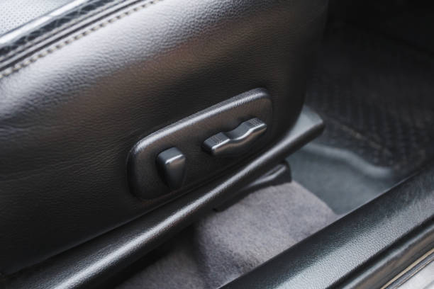 istock Arm adjusting the seat position in the car 1202051107