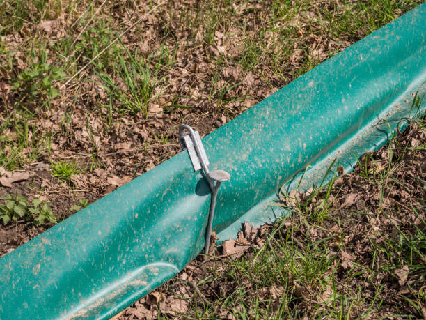 istock Fence on a road for frogs on the hike 1202051782