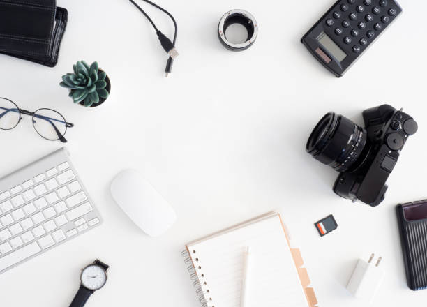 istock top view of photographer work station, work space concept with digital camera, memory card, keyboard and smartphone on white table background 1202052786