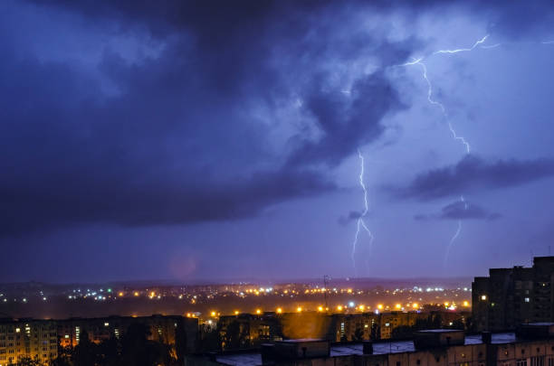 istock Thunderstorm with lightning and thunder over the night city 1202053777
