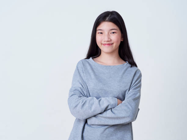 istock Cute young woman standing isolated on white backgroundon. 1202054112
