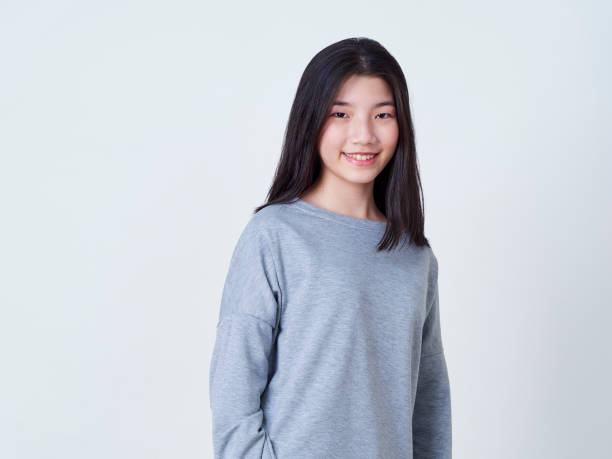 istock Cute young woman standing isolated on white backgroundon. 1202054113