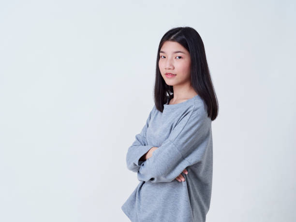 istock Cute young woman standing isolated on white backgroundon. 1202054114