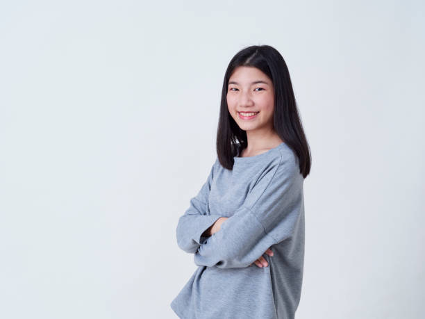 istock Cute young woman standing isolated on white backgroundon. 1202054116