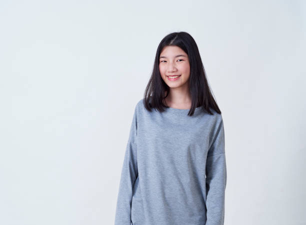 istock Cute young woman standing isolated on white backgroundon. 1202054130