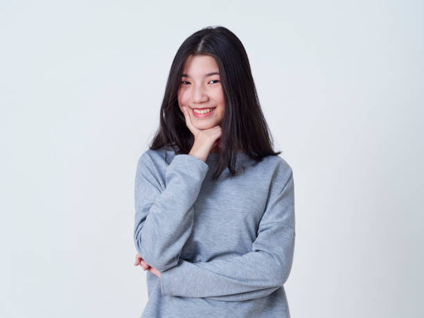 istock Cute young woman standing isolated on white backgroundon. 1202054177
