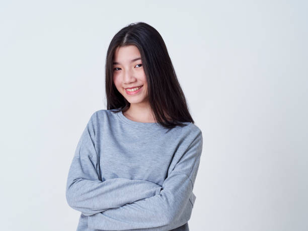 istock Cute young woman standing isolated on white backgroundon. 1202054228