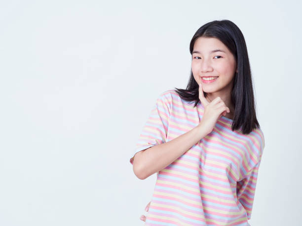 istock Cute young woman standing isolated on white backgroundon. 1202054242