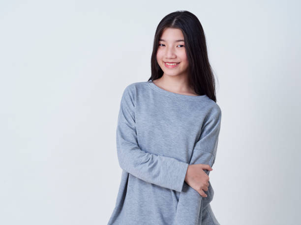 istock Cute young woman standing isolated on white backgroundon. 1202054252