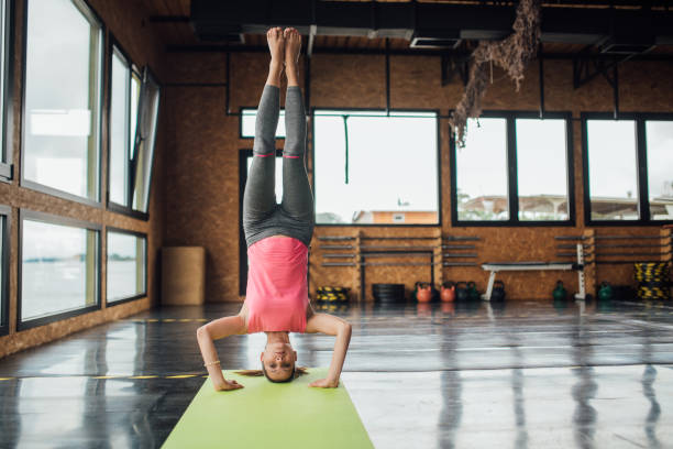 istock Happy woman doing yoga 1202055337